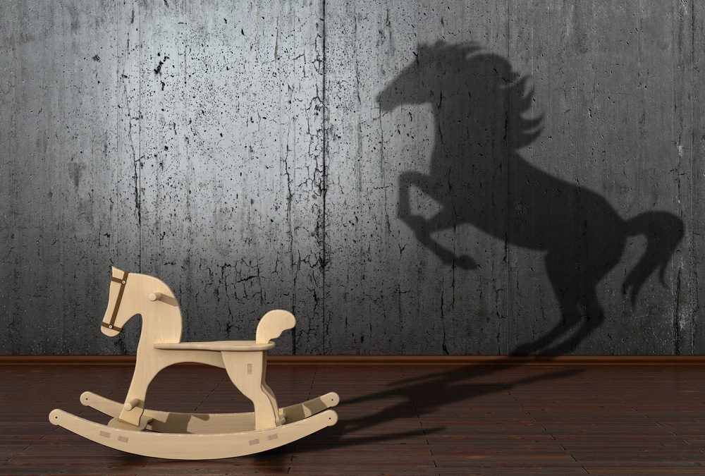 rocking horse with racing horse shadow